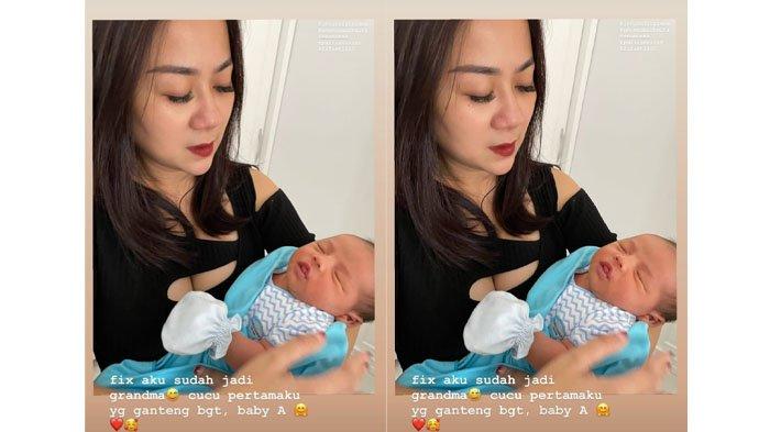 Tante Ernie gendong cucu pertama