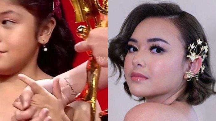Sebuah tato yang diduga bertuliskan nama kekasih mendadak menyembul di tangan Amanda Manoopo.
Amanda Manopo lawan main Arya Saloka di Sinetron Ikatan Cinta selama ini selalu menutupi tato kala sedang syuting dengan plester.