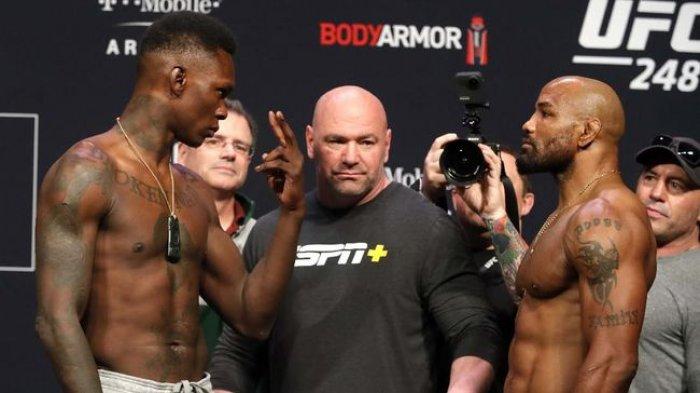 Dua petarung UFC, Israel Adesanya dan Yoel Romero pada sesi timbang badan, beberapa waktu lalu. Keduanya akan bentrok pada, Sabtu (07/03/2020) malam waktu Amerika Serikat (AS), atau Minggu (08/03/2020) WIB.