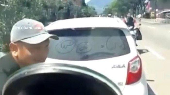 Tangkapan layar aksi premanisme dialami seorang sopir mobil boks. Diduga aksi tersebut terjadi di Jalan Raya Bandung- Garut.