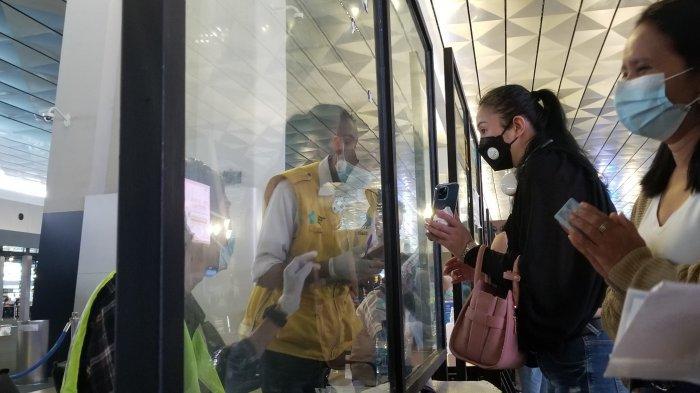 Lokasi validasi kartu bebas Covid-19 di Terminal 3 Bandara Soekarno-Hatta menjelang Libur Natal dan Tahun Baru 2021, Selasa (22/12/2020).