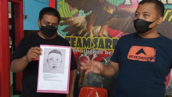 Kasat Reskrim Polres Maros, AKP Nico Ericson menunjukkan sketsa wajah korban yang tewas terbakar di Mallawa, Maros