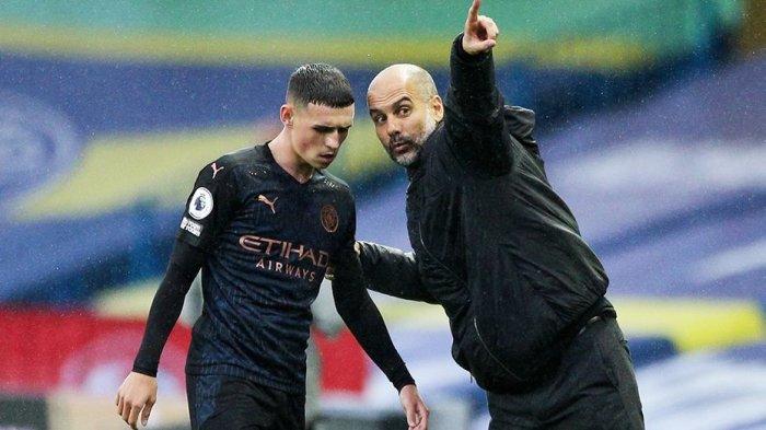 Pep Guardiola dan Phil Foden
