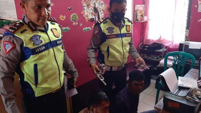 Dua pelaku penodongan senjata api ditangkap polisi. (KOMPAS.com/TRI PURNA JAYA )