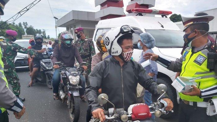 Polres Kota Bitung, Sulawesi Utara memperketat penjagaan di pintu masuk guna mencegah makin menyebarnya virus corona.