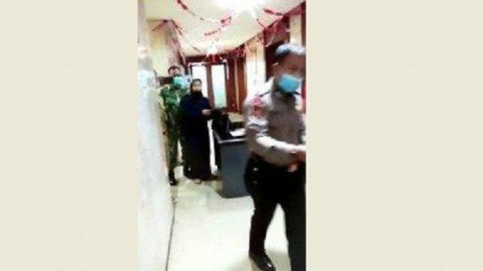 Tangkapan layar seorang wanita membawa bensin menyelinap masuk ke Balai Kota DKI