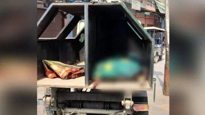 Jenazah seorang wanita yang terkena Covid-19 dibawa pakai truk sampah.