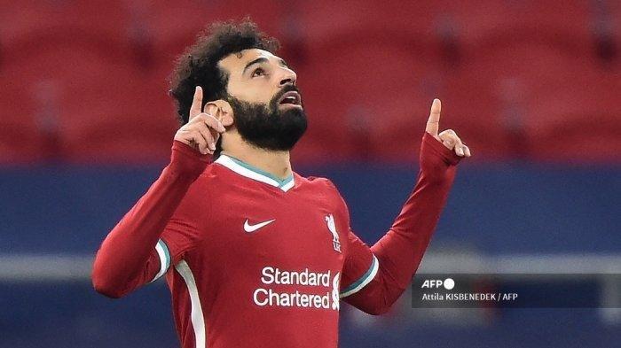 Gelandang Liverpool Mesir Mohamed Salah merayakan gol pertama timnya selama pertandingan sepak bola leg kedua babak 16 besar Liga Champions UEFA antara Liverpool dan RB Leipzig di Puskas Arena di Budapest, Hongaria, pada 10 Maret 2021.