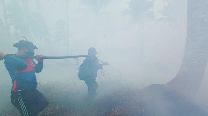 Tim sempat terjebak asap tebal di lokasi Karhutla saat memadamkan api di Kecamatan Kuala Kampar pada Sabtu (13/3/2021) lalu.