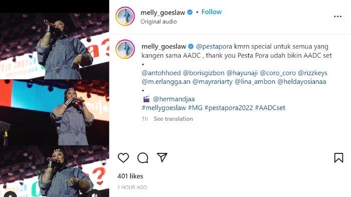 Melly Goeslaw tampil dengan baju jumpsuit berwarna jeans