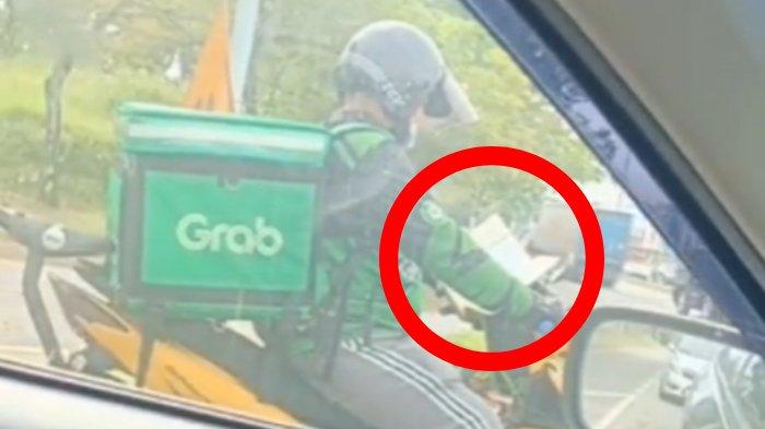 Viral driver ojol baca Al Quran di lampu merah