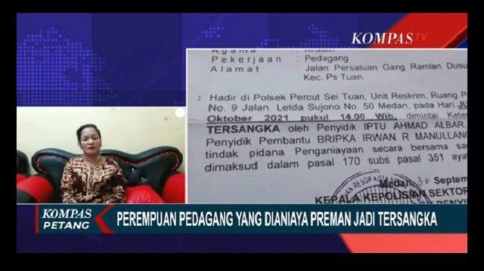 Pedagang perempuan yang dianiaya preman di Pasar Gambir Tembung, Deli Serdang, Sumatera Utara, justru ditetapkan sebagai tersangka oleh polisi.