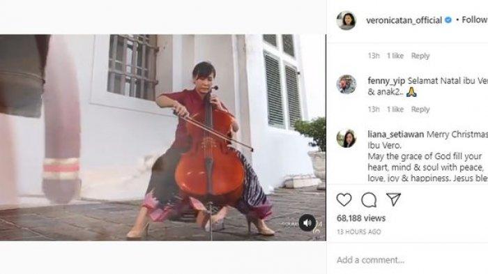 Veronica Tan saat merayakan Natal dengan bermain Cello