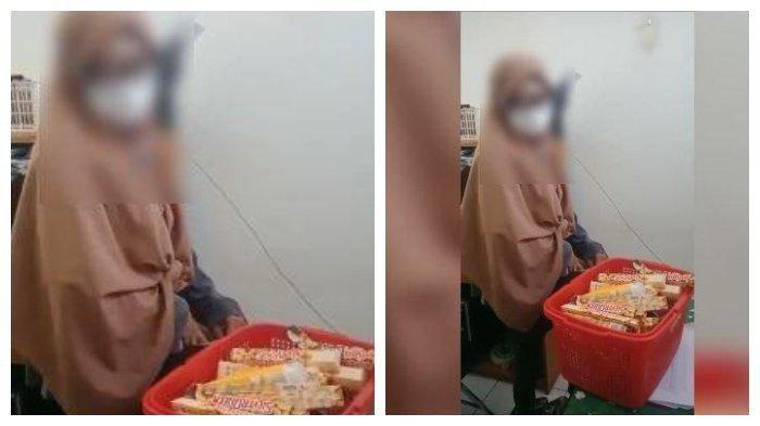 Tangkap layar maling wanita di supermarket yang mencuri banyak cokelat