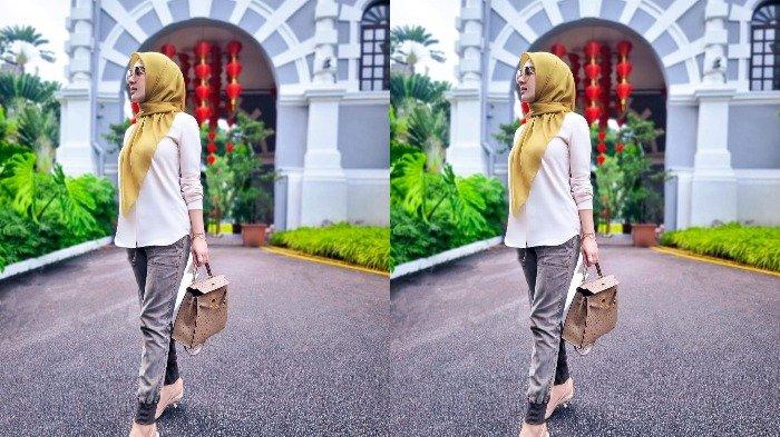 Gaya penampilan Syahrini saat di Singapura.
