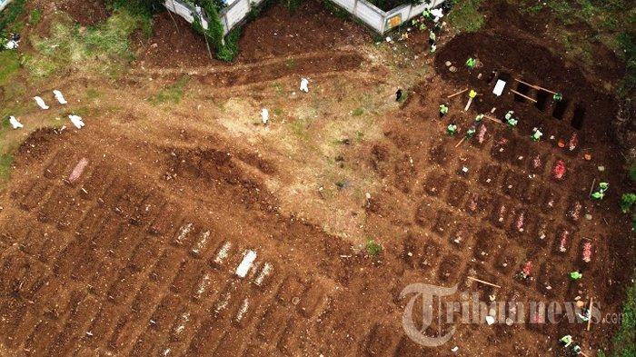 Suasana di Taman Pemakaman Umum (TPU) Srengseng Sawah, Jakarta Selatan, Jumat (15/1/2021) lalu. Pemerintah Provinsi DKI Jakarta membuka area pemakaman untuk jenazah Covid-19 di TPU Srengseng Sawah karena TPU khusus Covid-19 sebelumnya di Pondok Ranggon, Jakarta Timur, dan Tegal Alur, Jakarta Barat, telah penuh.