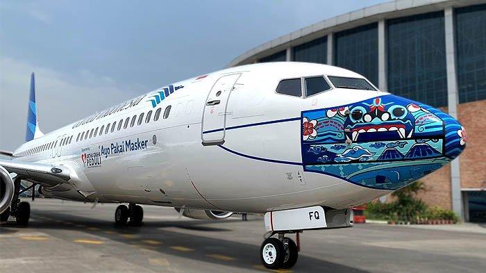 Gambar Barong Bali, motif Mega Mendung, dan gunung berapi dalam masker pesawat Garuda Indonesia, untuk mendukung kampanye Ayo Pakai Masker.